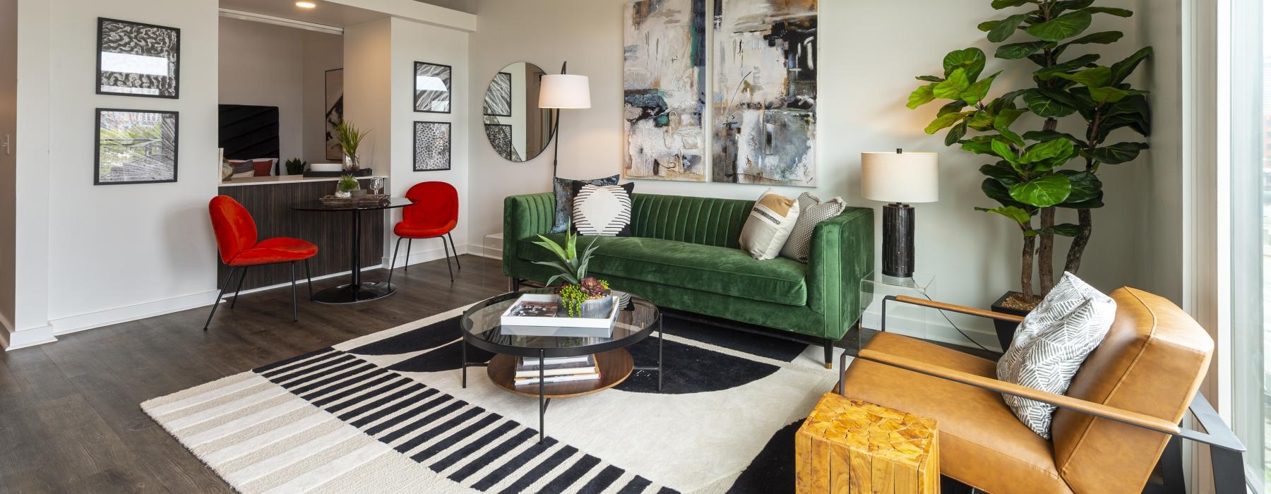 a living room with a couch and chairs