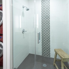Bathroom options with thoughtful details a bathroom with a washer and dryer