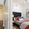 a bedroom with a bed and a chair
