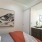 a bedroom with a mirror and a bed