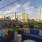 a room with blue couches and a view of a city