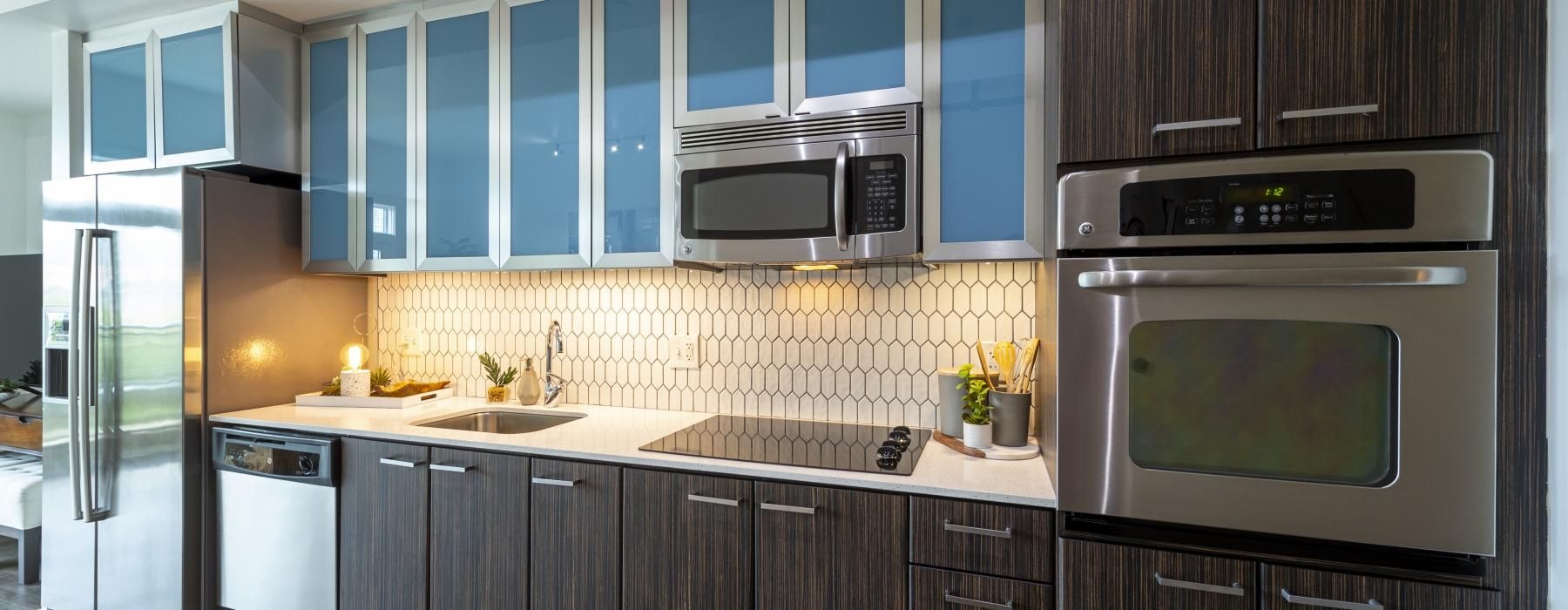 a kitchen with blue cabinets