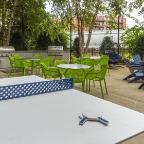Quick access to state-of-the-art amenities a table with chairs and tables outside